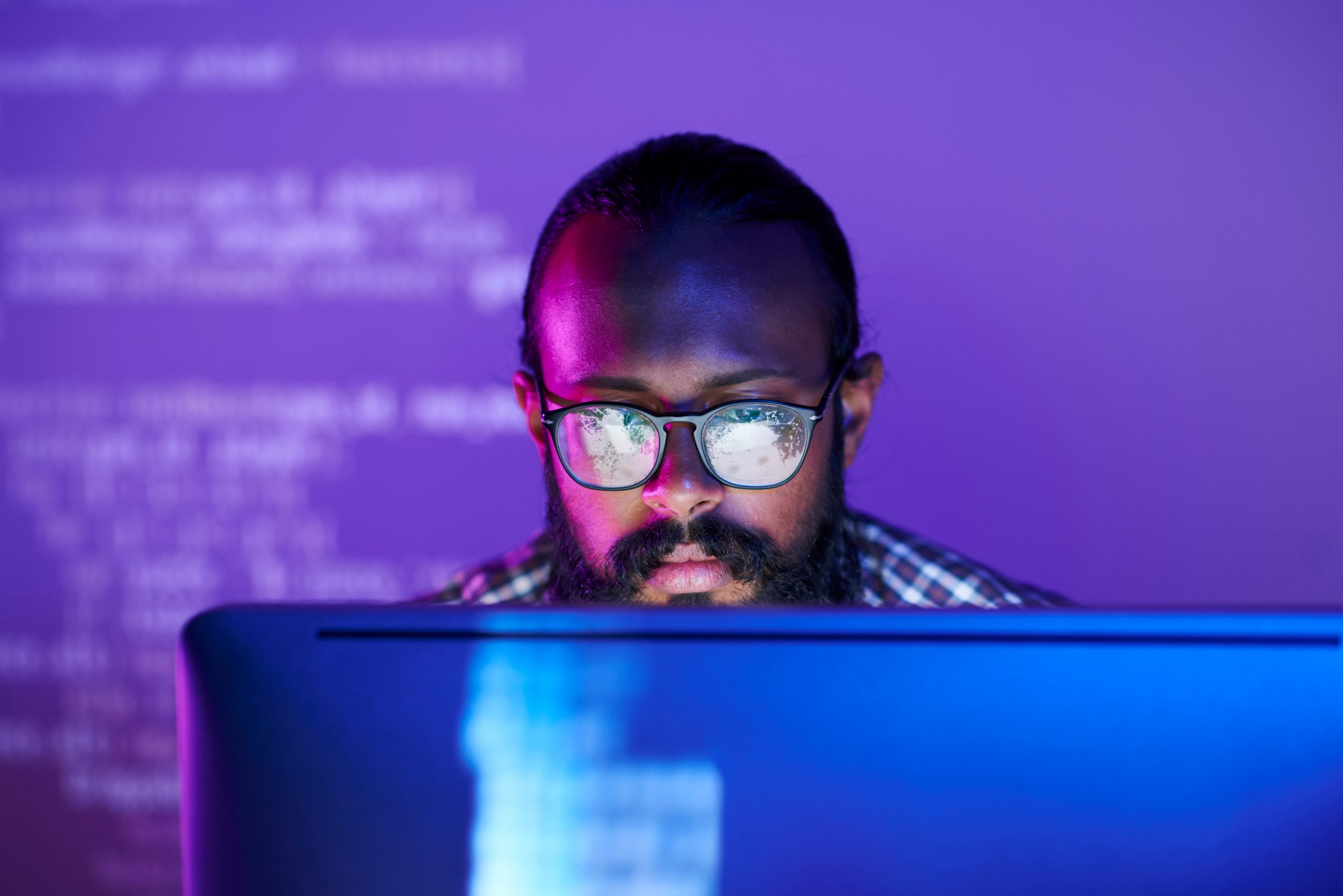 Young,Serious,Programmer,In,Eyeglasses,Concentrating,On,Working,With,Coded